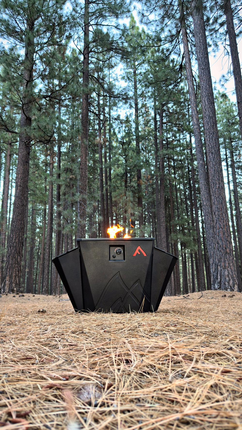Floating Flame lit on a pine-needle forest floor near Lake Tahoe