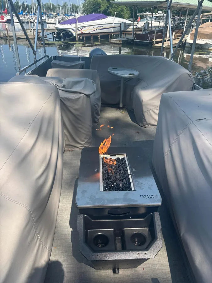 Greg M. and his wife beside the Floating Flame