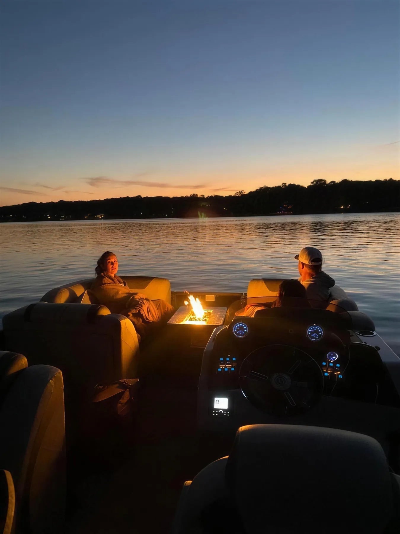 Floating Flame lit on a pontoon deck at night